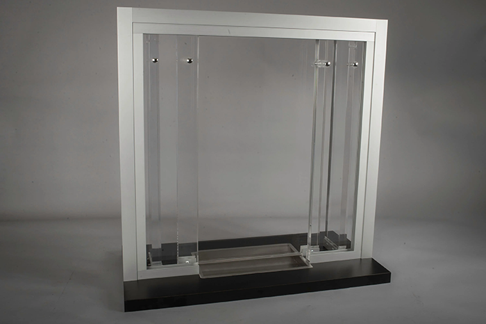 A baffle transaction window that is stronger than glass and impact resistant to ballistic threats while still allowing for easy communication