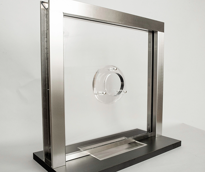 A hole and backer transaction window that is durable and includes a voice port for voice transmission alongside the transparency of faces