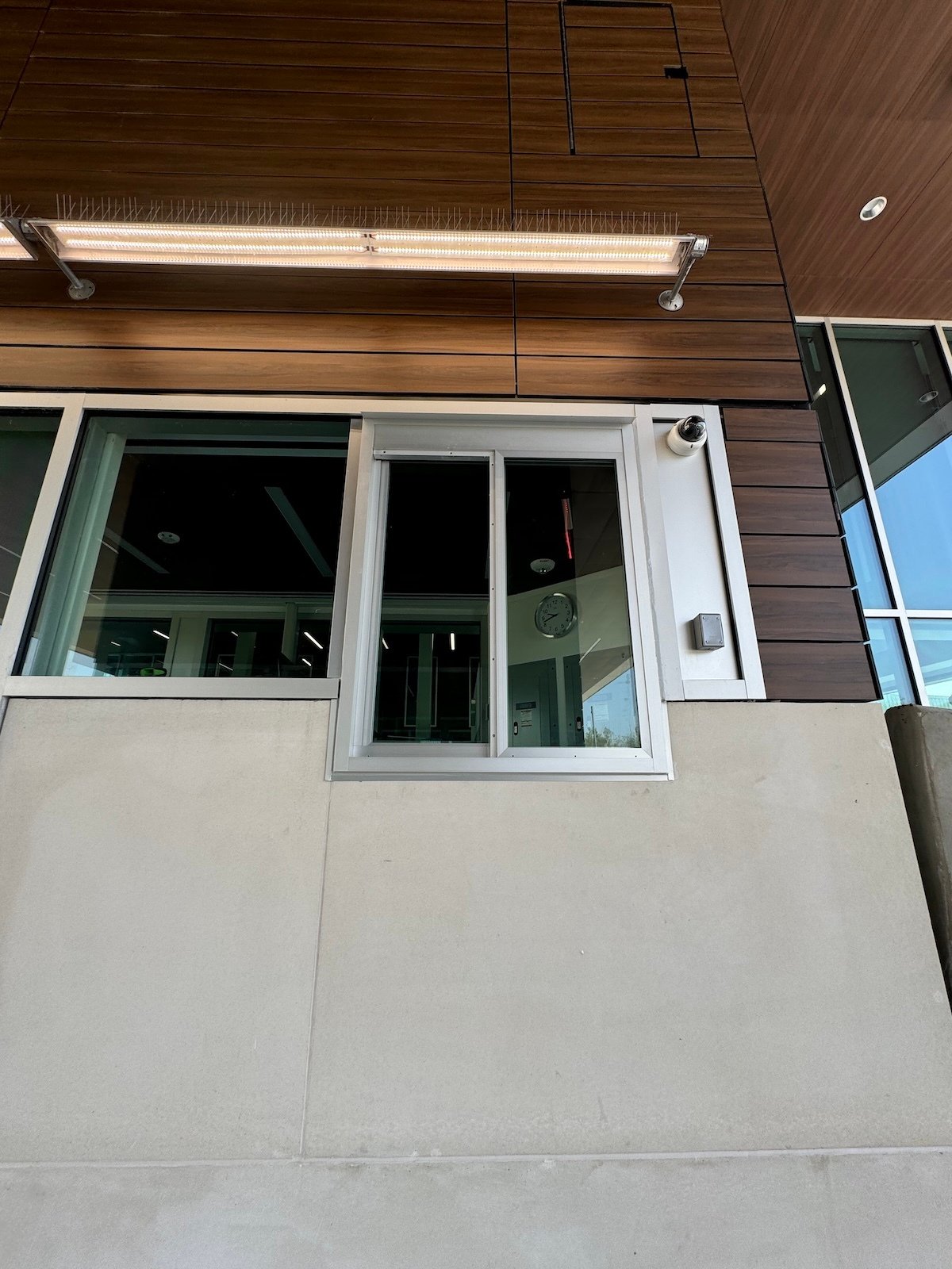 A photo showing an exterior transaction window that combines strength with optical clarity and is bullet-resistant, which is different than virtually unbreakable