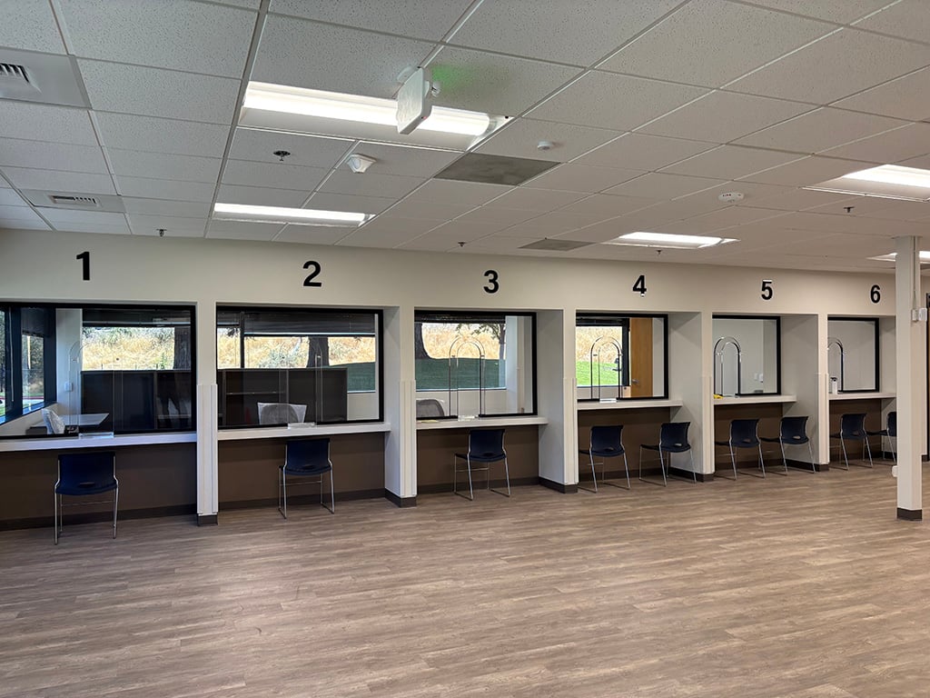 A photo showing laminated polycarbonate sheets tested to Level 3 ballistic resistance as a form of safety glass in the interior of public building