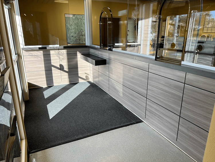 A series of bulletproof transaction windows to deliver ballistic protection while maintaining functionality in a utility office setting