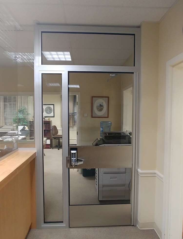 An acrylic door that is designed for durability and bullet resistance, which is different than shatter-resistant solutions