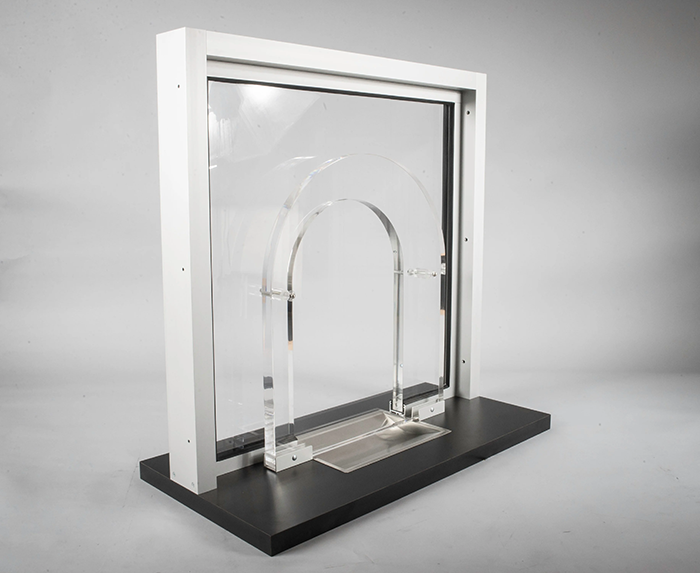 An arched transaction window made with specific sheet dimensions to meet ballistic protection needs