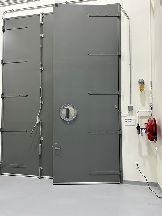 An example of a steel door outfitted with features that make it bullet resistant to better handle potential threats