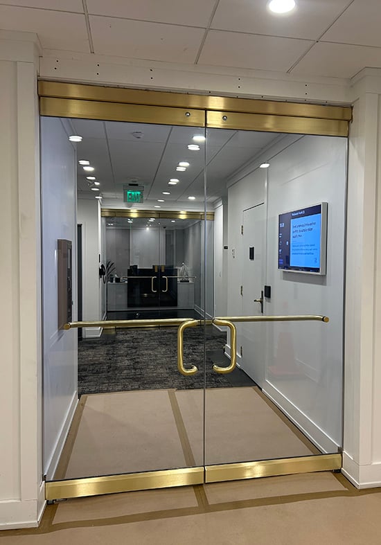 An example of all-glass doors fabricated using GCP, a laminated material made of layers of tempered glass and polycarbonate, to keep intruders out while providing transparency