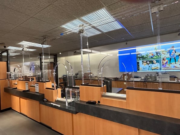 A bank with bandit barriers protecting employees from robberies.