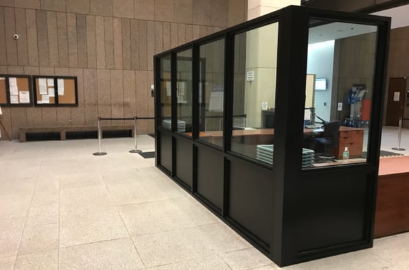 black security booth in marble entryway