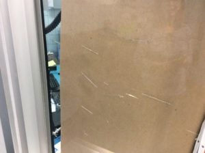 school security window damaged by cleaners