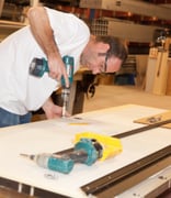employee assembling a ballistic door