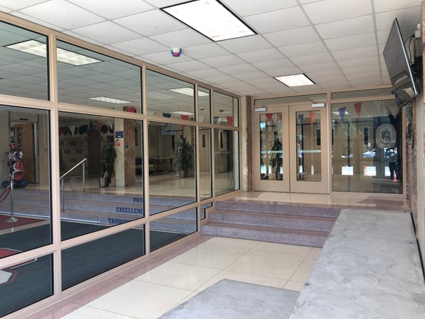 A secure vestibule with two sets of locking doors at a school