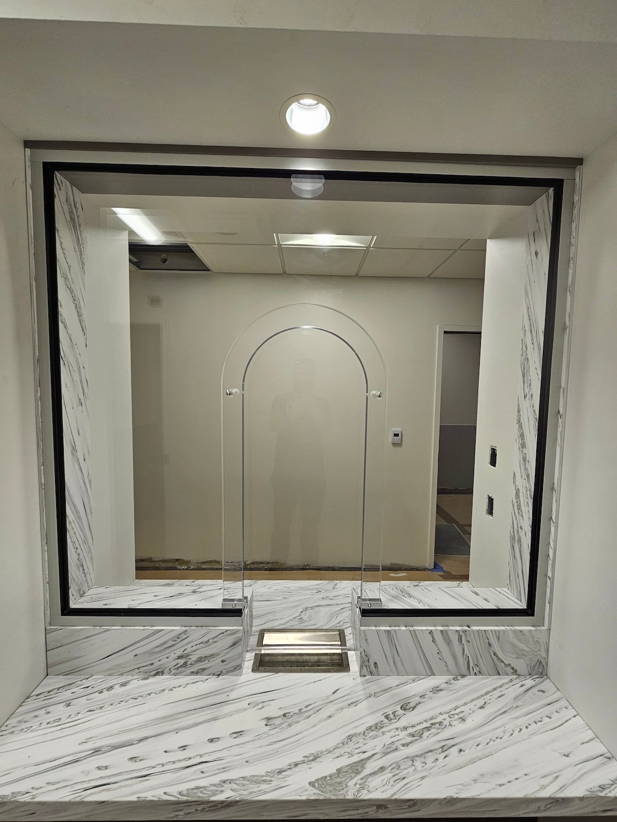 arched backer transaction window