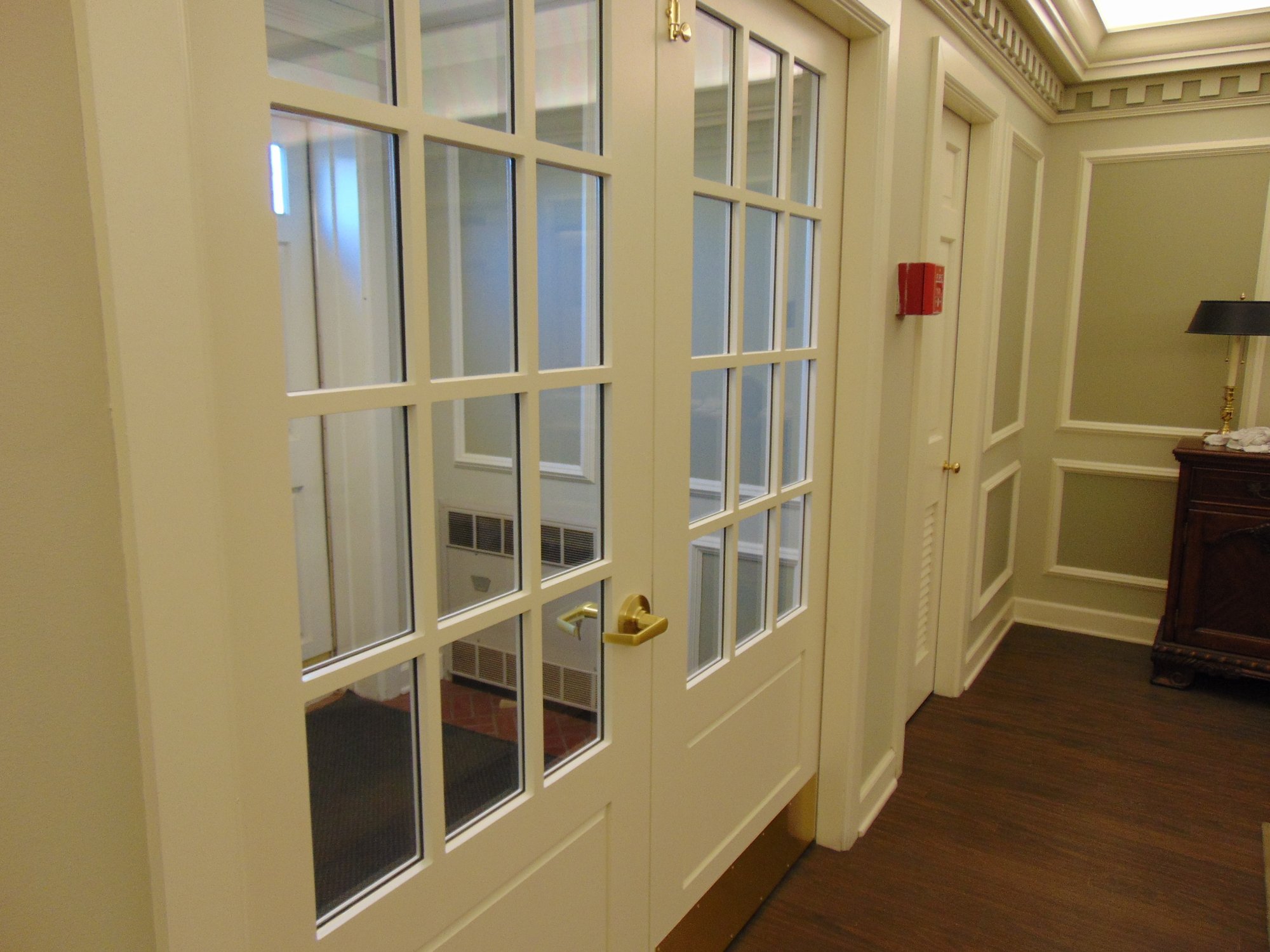 executive protection white doors with glass