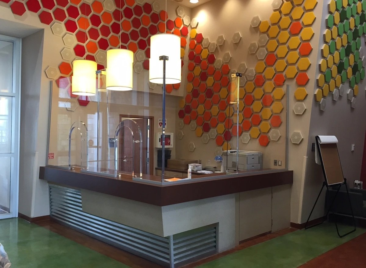 A bulletproof barrier at a reception desk