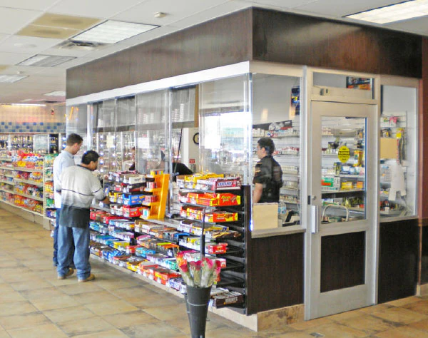 A photo showcasing a bullet-resisting barrier or bullet proof glass versus standard glass added to a gas station, alongside other small retail settings, to enhance security measures