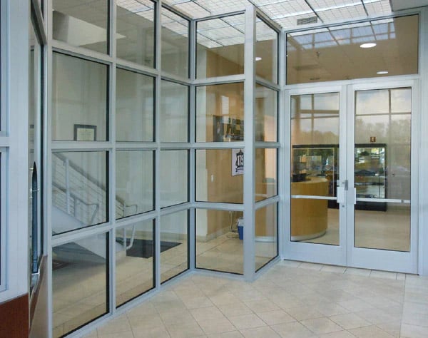 A photo showcasing the use of bullet proof window and door glass versus shatterproof glass or regular glass to delay entry from people trying to gain access and also stop bullets