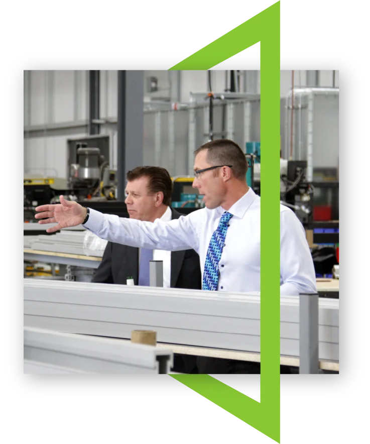 A photo showing business leaders in the TSS facility where bullet-resistant solutions are designed, engineered, and manufactured for police stations, commercial buildings, and more
