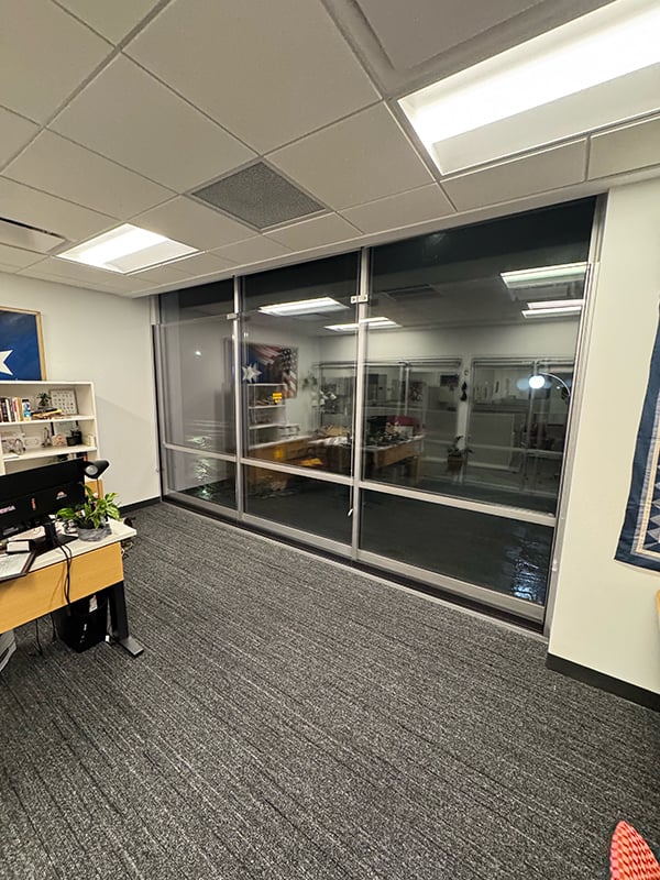 Polycarbonate backglazing, a form of bulletproof glass for businesses, that provides more protection than regular window glass without requiring a full window replacement